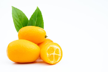 Ripe kumquats on white background