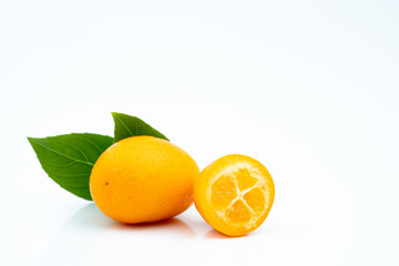 Ripe kumquats on white background