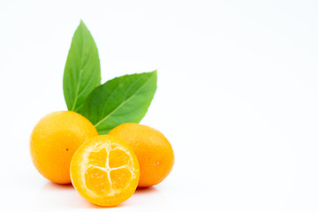 Ripe kumquats on white background