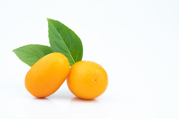 Ripe kumquats on white background