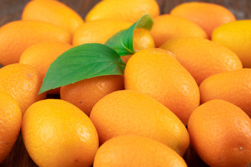 Kumquat fruits on wooden