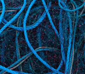 close up on Pile of various fishing nets on a dock
