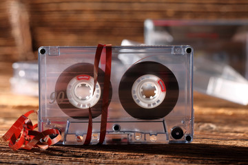 Classic audio cassette with pulled out of tape