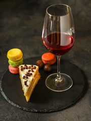 red wine, cake and macaroons, dessert (sweets). food background. top photo