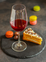 red wine, cake and macaroons, dessert (sweets). food background. top photo