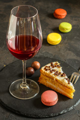 red wine, cake and macaroons, dessert (sweets). food background. top photo