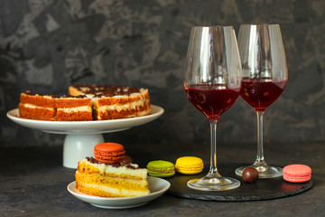 red wine, cake and macaroons, dessert (sweets). food background. top photo