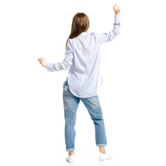 Woman in blue jeans and shirt dancing on white background isolation, back view