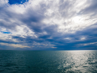 Sea view from gulf of Thailand with the horizon and cloudy sky 