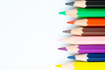 colored pencils on white background