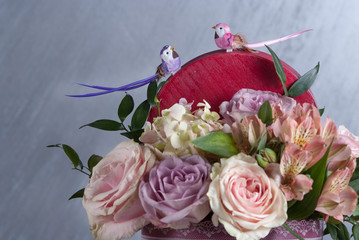 bouqet of flowers in box. No toned with natural color. Colored flowers. Selective focus, macro. Birds of top bouqet