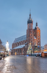 Fototapeta na wymiar Krakow, Poland, Christmas tree on Main Market Square and St Mary's church