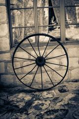 Fototapeta na wymiar Two tone photo of an old wagon wheel.