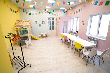 interior of children's playroom with table and Windows