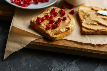 sandwich, pomegranate, peanut butter (sweet snack). Top Food background