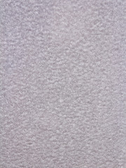 Texture of frozen snow and ice on a glass