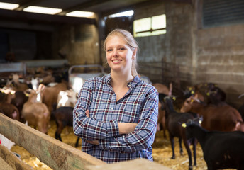 Successful woman farmer in the goat house