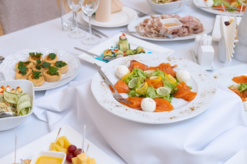 Sliced fish plate served lemon