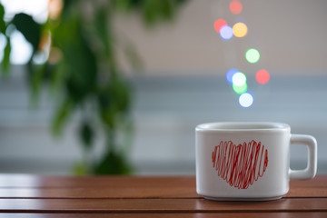tea- coffee cup on table and bokeh