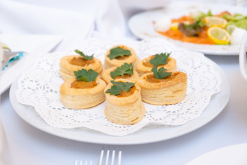 Vol-au-vents puff pastry cases filled with salted squid and octopus