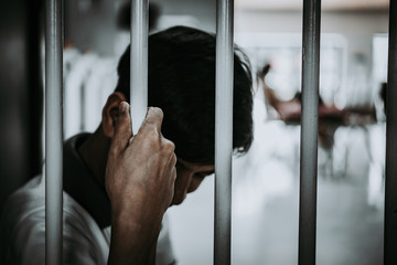 Hands of men desperate to catch the iron prison,prisoner concept,thailand people,Hope to be free.