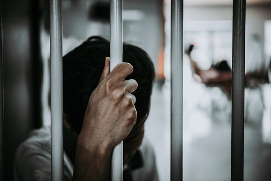 Hands of men desperate to catch the iron prison,prisoner concept,thailand people,Hope to be free.