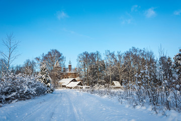 Country landscape with a ruined church on a frosty winter day.