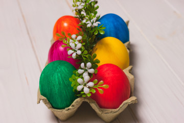 Easter eggs in a tray with flowers