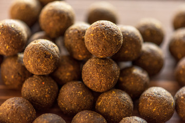 Carp baits on a wooden background.