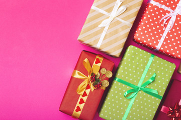 background pattern of gift boxes wrapped in decorative paper, top view, holiday concept