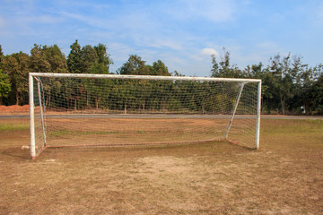 Old vacant football soccer goal gate in rural grass field in Chiang Mai,Thailand