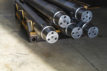 Large shafts after metalworking are in stock.