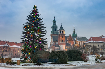 Fototapeta na wymiar Krakow, Poland, Wawel cathedral and Christmas tree, winter evening