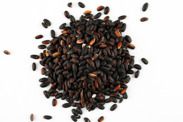 Pile of red rice on a white background