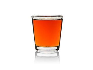 Whiskey in shot glass, isolated on a white background