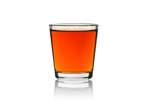 Whiskey in shot glass, isolated on a white background