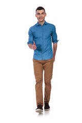 Fototapeta premium relaxed casual man walking forward and making ok sign