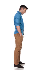 Fototapeta premium relaxed casual man waits in line and looks down