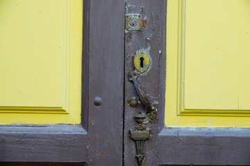 wooden door with lock and knocker