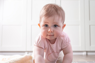 Fototapeta premium baby playing on floor