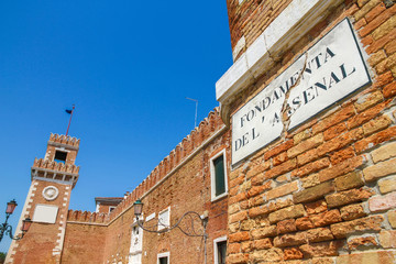 View on the venetian Arsenal in Castello region in Venice, Italy on a sunny day.