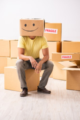 Happy man with box instead of his head 