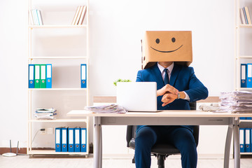 Happy man employee with box instead of his head