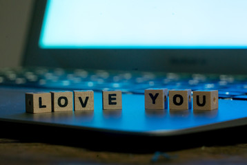 Close up of laptop and love message in stay connected, online dating or shopping for Valentines day