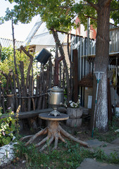 Household utensils. The mess in the yard. Samovar in the center