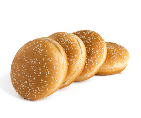 Burger buns on white background. A few buns cut in half close up on a white background.