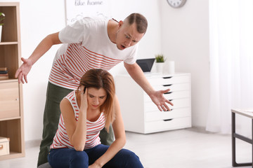 Unhappy couple having argument at home. Concept of divorce