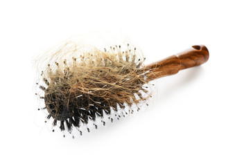 Brush with fallen down hair on white background