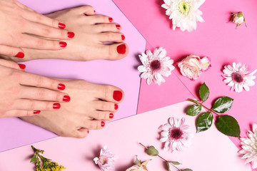 Fototapeta na wymiar Young woman with beautiful pedicure and flowers on color background