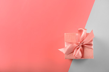 Small gift box on color background